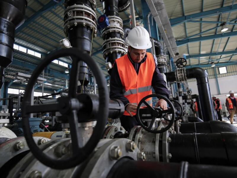 A Palestinian employee works at a desalination plant during the inauguration of the first phase of the project on January 19, 2017, in Deir al-Balah in central Gaza. (AFP/Said Khatib)