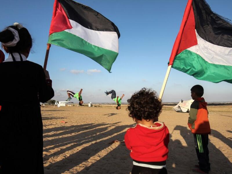 Everyone joins in the fun. Young and old watch. April 10, 2018. SAID KHATIB / AFP