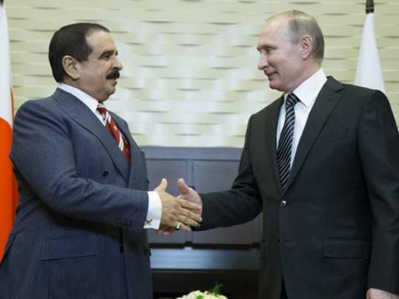 Russian President Vladimir Putin shakes hands with Bahrain's King Hamad bin Isa Al-Khalifa during a meeting in Sochi. (AFP)