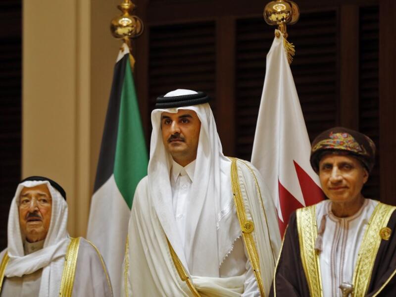 Qatari Emir Sheikh Tamim bin Hamad Al Thani (center) with his Kuwaiti and Omani counterparts at the GCC summit. (file photo)