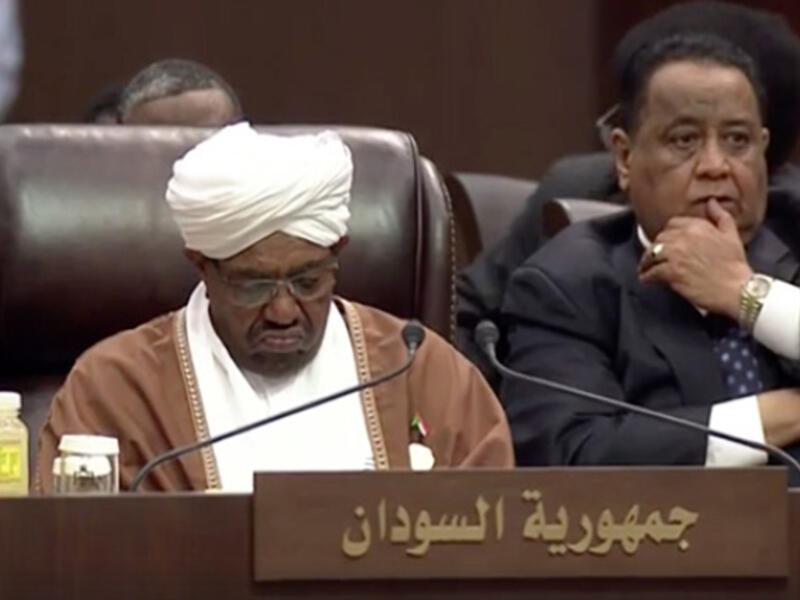 Sudan’s Omar al-Bashir might be wanted by the ICC for war crimes, but he doesn’t seem to be too worried about a potential arrest- he looks bored enough to fall asleep here!