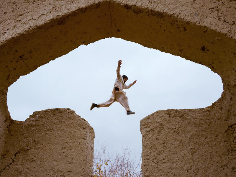 An Afghan boy plays in the ruins of a house that at one point belonged to the 13th-century Perisan poet, Jalal ad-Din Muhammad Rumi, on the outskirts of Mazar-i-Sharif. 