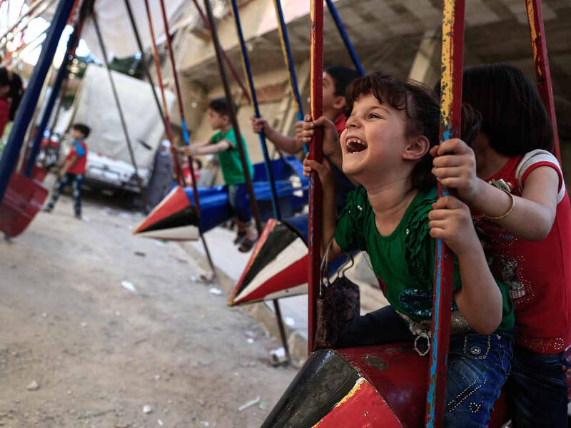 Believing in positive change, a resident of Douma, Abu Ali al Bitar, started to transform former missiles into swings. "I took something that used to kill and turned it into a toy that makes children smile. If children ask me what all the noise and smoke is I always say 'don't panic, it's just Allah giving you something new to play with."