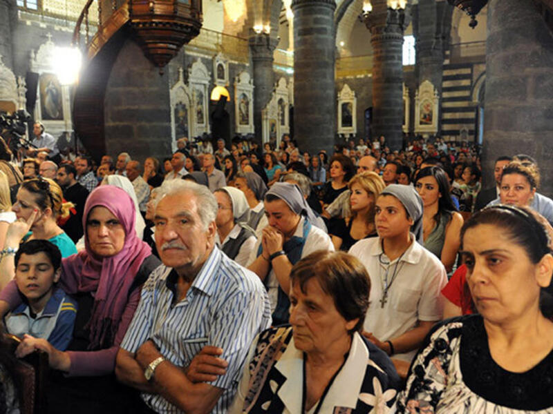 After a group of nuns and orphanage workers were kidnapped and held for a week, Syrian Christians and Muslims attended a prayer vigil for peace at the Lady of Dormition, the Melkite Greek Catholic patriarchal cathedral in the Old City of Damascus, on September 7, 2013. 