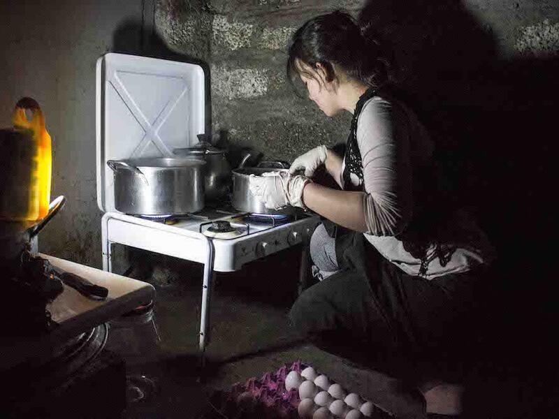 A Yazidi woman in the Khanke refugee camp in Iraq is boiling eggs to celebrate the new year. Eggs symbolize the earth, which is said to have been transformed from a liquid to a solid status, marking a new beginning of life. 