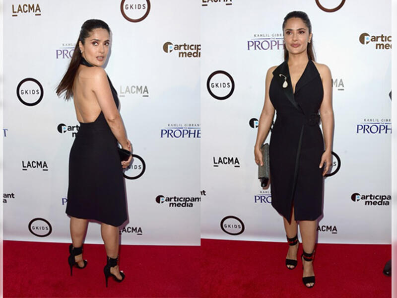 Salma Hayek a vision in tuxedo-style wrap dress at premiere of her animated movie Kahlil Gibran's The Prophet. (AFP)
