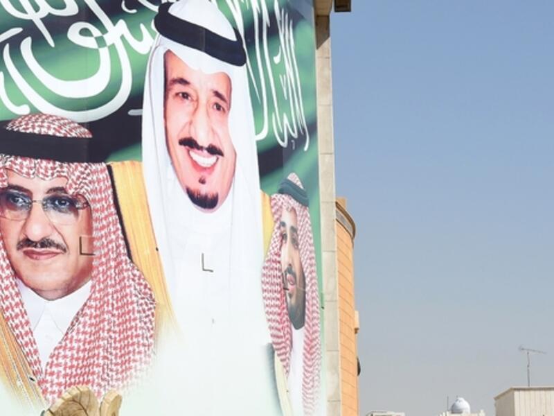 A banner Saudi King Salman bin Abdulaziz, Crown Prince and Interior Minister Mohammed Bin Nayef in Riyadh (AFP)
