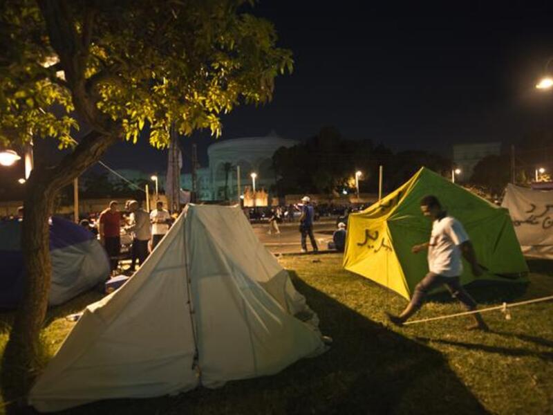 Opponents to Egypt's Islamist President set up tents in front of the Egyptian presidential palace during a sit-in in Cairo (AFP)