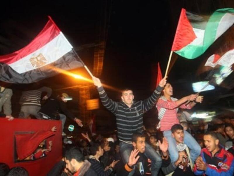 Palestinians in Gaza celebrate the victorious ousting of President Mubarak from power after a presidency that spanned three decades.
