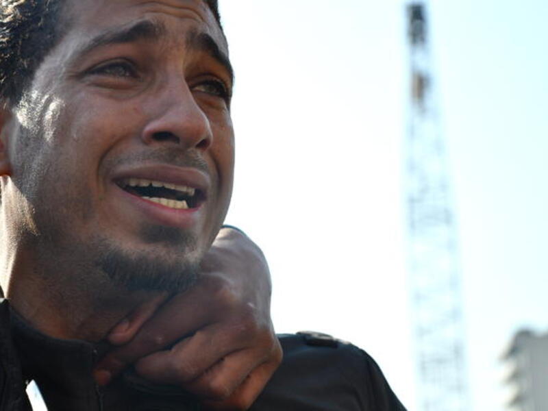 Tears for the suffering of his country- after years of frustration and pent up but erstwhile silent rage, this man is overwhelmed by the intensity as he opens the floodgate for tears of a nation united in emotion.