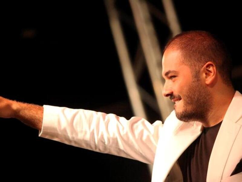 Rami Ayyash sings at the Baysour Festival, before a crowd of 10,000 fans. The festival was sponsored by Lebanese Cabinet Minister, Ghazi Aridi.
 
