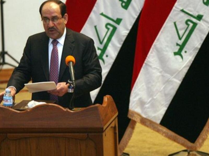 Iraqi Prime Minister Nuri al-Maliki addresses the parliament during a session in which lawmakers unanimously approved the new government which will be headed by the incumbent Shiite premier.