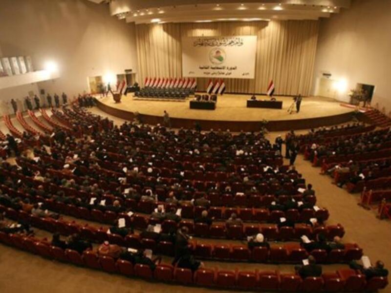 Iraqi MPs are seated in parliament in Baghdad on December 21, 2010 as lawmakers gave Prime Minister Nuri al-Maliki's government a vote of confidence and adopted a 43-point program aimed at liberalizing the economy and fighting terrorism.