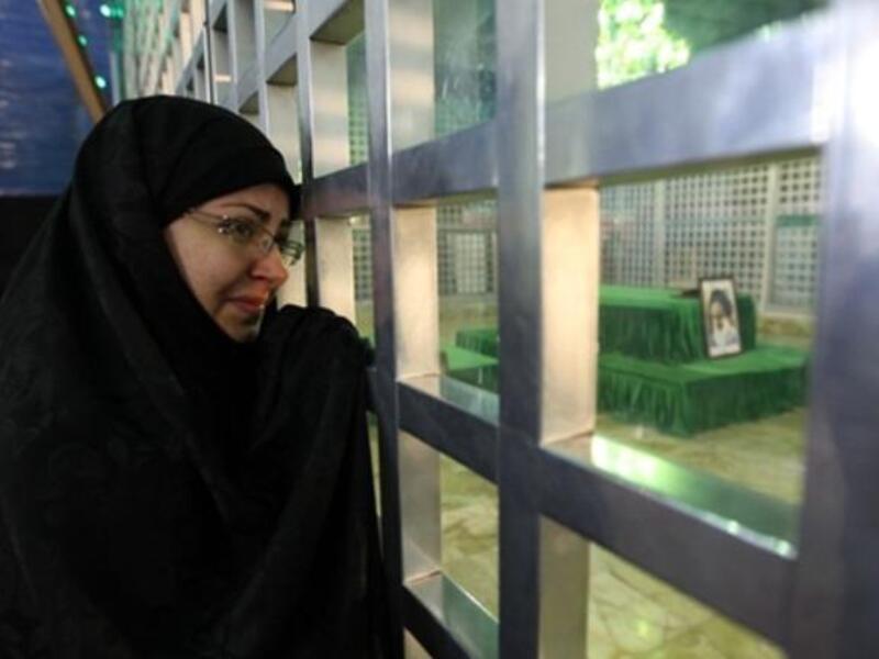 An Iranian woman visit the shrine of Ayatollah Ruhollah Khomeini, the late founder of the Islamic republic.