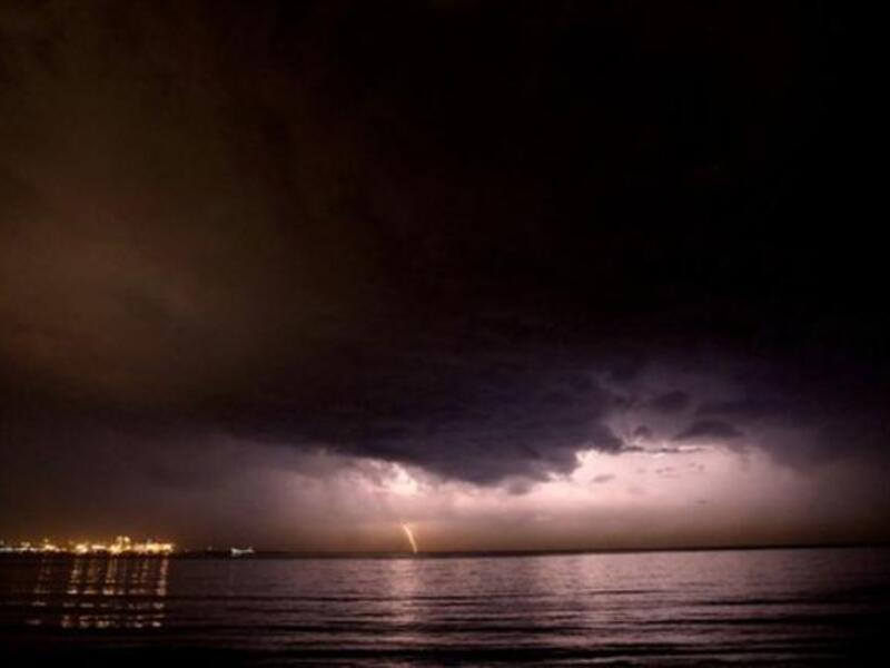 Lebanon, Beirut : Thunder strikes off the shores of Beirut as rain approaches after several months of drought.