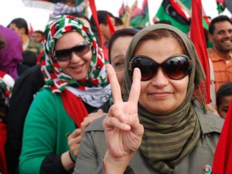 Thousands of Libyans celebrate during a ceremony announcing the liberation for the country in the eastern city of Benghazi. The 
mood is jubilant, and not even criticism about the nature of the death of Kadhafi is dampening anybody's revelry.