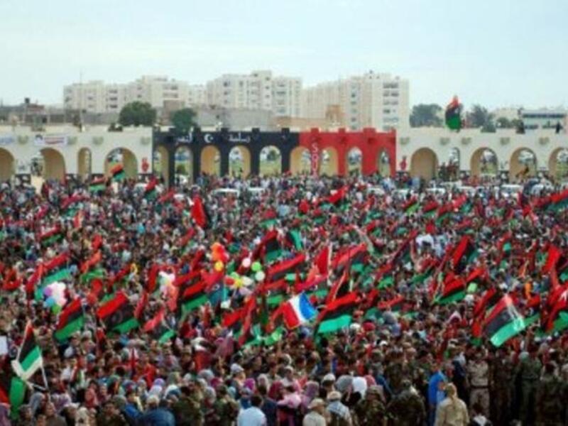 Thousands of Libyans celebrate during a ceremony announcing the liberation for the country in the eastern city of Benghazi  after ousted despot Moamer Kadhafi was captured and killed. A series of optimistic speeches by the new interim leaders ushered in the new age of Libya and paying tribute to the courageous efforts that got them to this point.