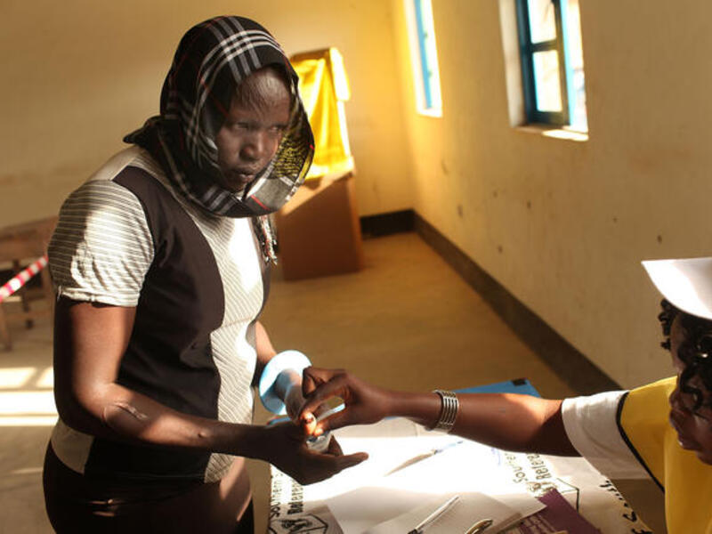 A woman votes during the first day of voting for the independence referendum.