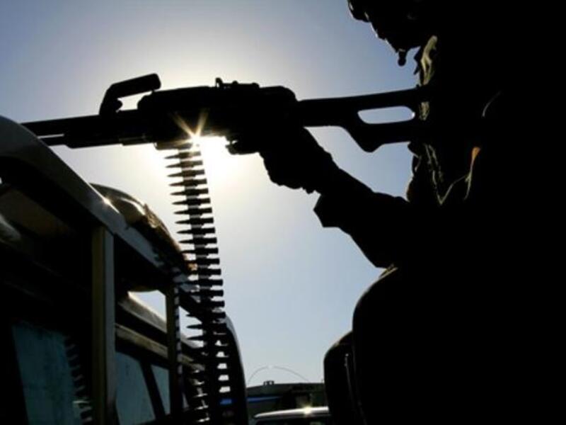 A UN peace keeper mans a machine gun as security remains tight.