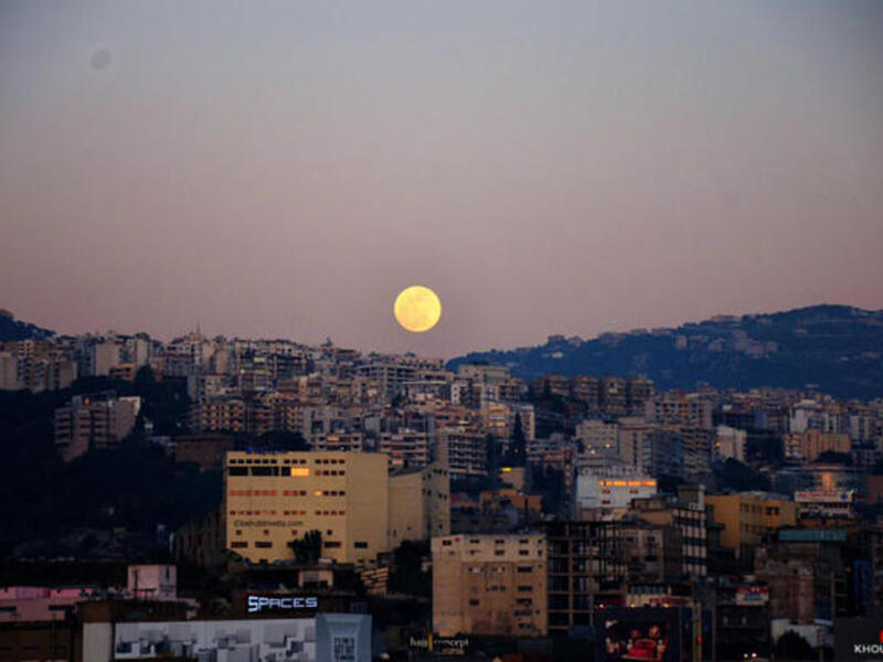 A supermoon rising up and above Beirut, Lebanon.