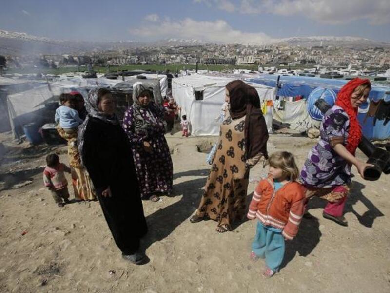 Women at a makeshift camp in Lebanon