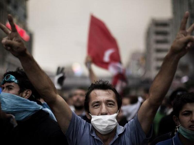 Face-mask, double victory sign, this Ankara demonstrator knows exactly how to do it. Huge rallies were held after the government apologised to wounded protesters and said it had ‘learnt its lesson’