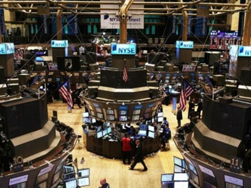 Traders work on the floor of the New York Stock Exchange in New York City. U.S. Attorney General Eric Holder announced yesterday that the Justice Department is conducting a criminal investigation of Wall Street.