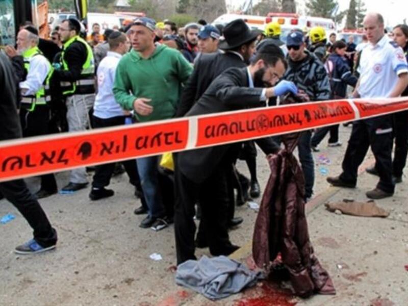 Israeli paramedics and emergency services rush to the scene of a massive bus explosion.