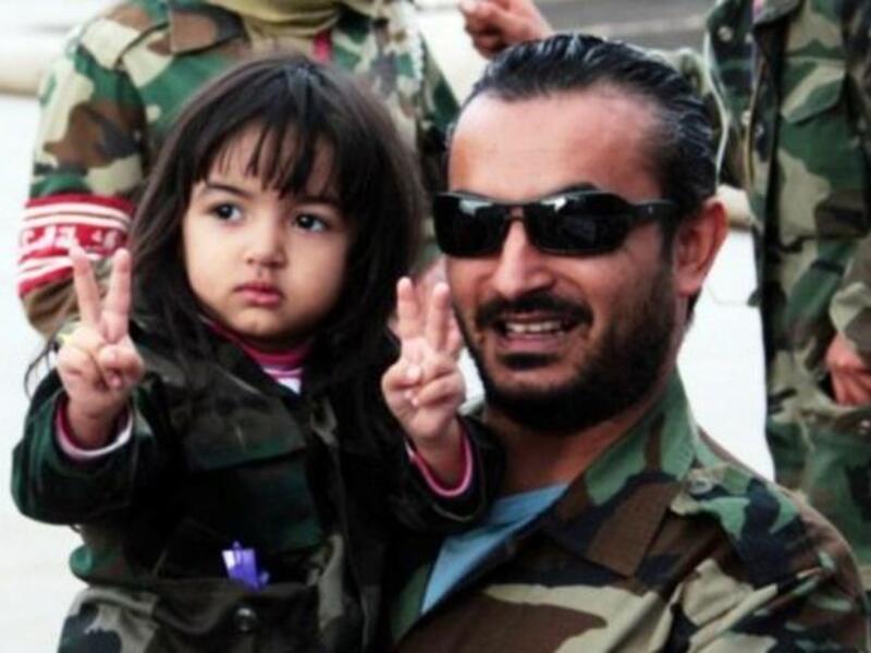 A promising future awaits the new Libyan generation: A man celebrates with child the capture of once heir apparent of late father Colonel Gaddafi. Libyan leaders promise that his second son will be tried in the International Criminal Court (ICC), and held to account for charges against him, possibly answering to the crimes of his untried father. 