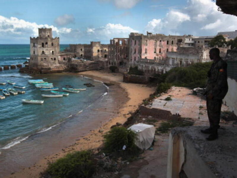 African Union soldier looks out over the Indian Ocean in Mogadishu (AFP)