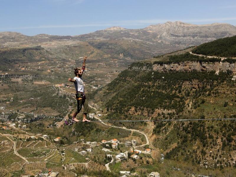 Lebanese Gino Traboulsi walks on a tightrope over the valley of Afqa, North East of the capital Beirut, on April 3, 2016.
Patrick BAZ / AFP