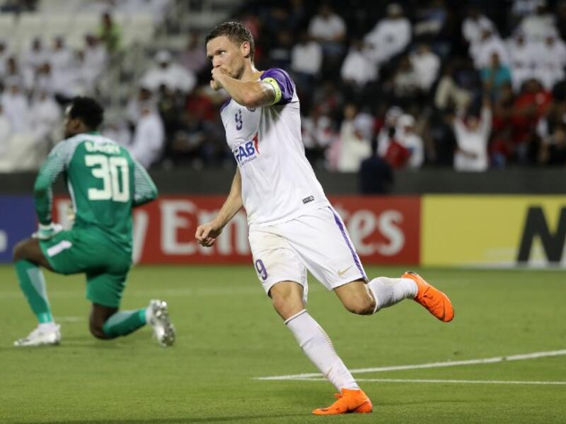 Al Ain FC's Swedish forward and captain Marcus Berg celebrates after scoring a goal against Al-Rayyan SC during their Asian Champions League football match at Jassim Bin Hamad Stadium in Doha on April 16, 2018.
KARIM JAAFAR / AFP