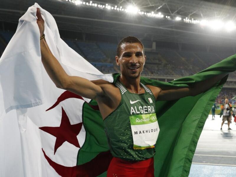 Algeria's Taoufik Makhloufi celebrates after winning second place in the Men's 800m Final during the athletics competition at the Rio 2016 Olympic Games at the Olympic Stadium in Rio de Janeiro on August 15, 2016.
Adrian DENNIS / AFP