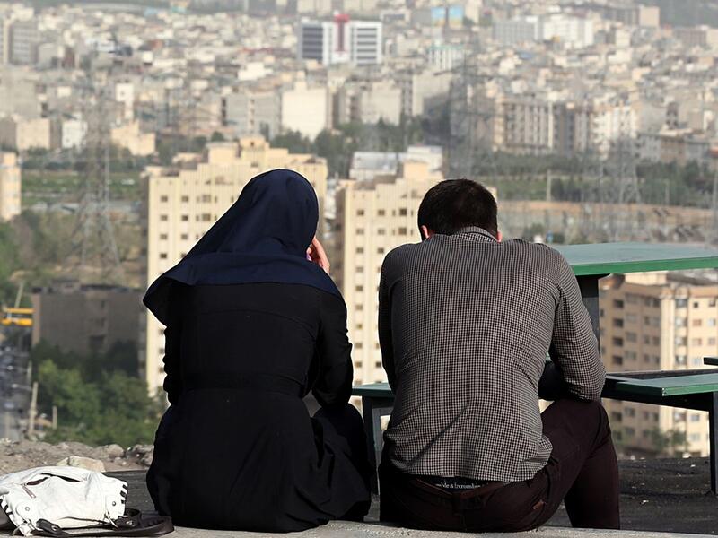 What do average Iranians see in their futures as the nuclear deal gets implemented?  (AFP/Atta Kenare)
