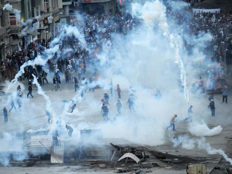 Protestors clash with Turkish riot policemen on Taksim square on June 11 (Bulent Kilic / AFP)