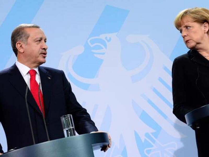 Turkish President Recep Tayyip Erdogan and German Chancellor Angela Merkel (AFP)