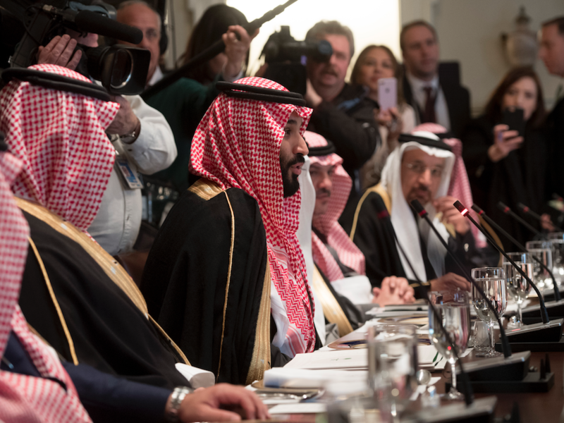 Saudi Arabia's Crown Prince Mohammed bin Salman (C) speaks alongside members of his delegation during a lunch meeting with US President Donald Trump in the Cabinet Room of the White House in Washington, DC, March 20, 2018.  (SAUL LOEB / AFP)