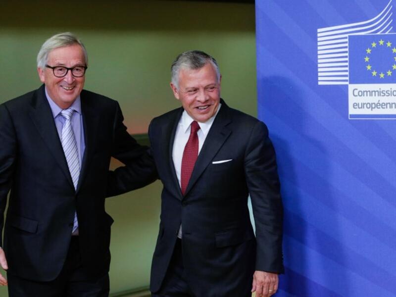 President of the European Commission Jean Claude Juncker (L) welcomes Jordanian King Abdullah II (R) at the European Commission headquarters in Brussels, ahead of a meeting on December 12, 2018. (AFP)