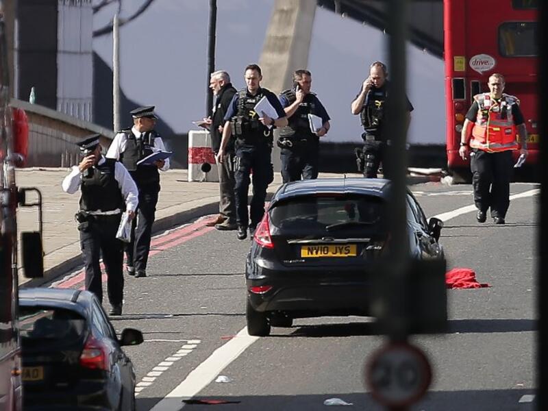 Members of the Police and Ambulance service assess the scene on London Bridge in London on June 4, 2017, following a terror attack. (Daniel Leal-Olivas/AFP)