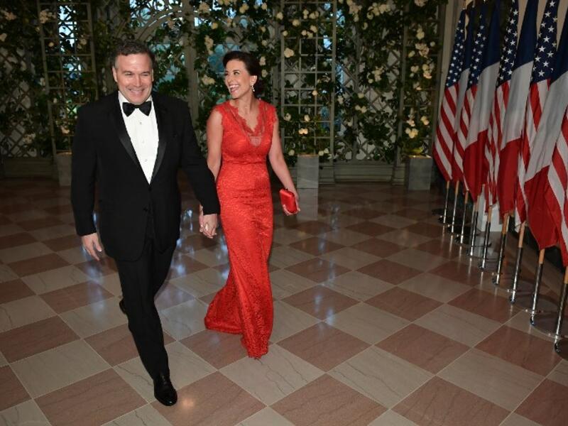 US policy strategist Dina Powell and husband Richard Powell arrive in the “Booksellers Area” of the White House to attend a state dinner honoring France's President Emmanuel Macron on April 24, 2018 in Washington, DC. 
MANDEL NGAN / AFP