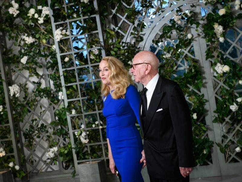Media mogul Rupert Murdoch and wife Jerry Hall arrive in the “Booksellers Area” of the White House to attend a state dinner honoring France's President Emmanuel Macron on April 24, 2018 in Washington, DC. 
MANDEL NGAN / AFP