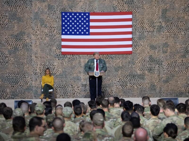 US President Donald Trump speaks to members of the US military during an unannounced trip to Al Asad Air Base in Iraq, December 26, 2018. 
SAUL LOEB / AFP