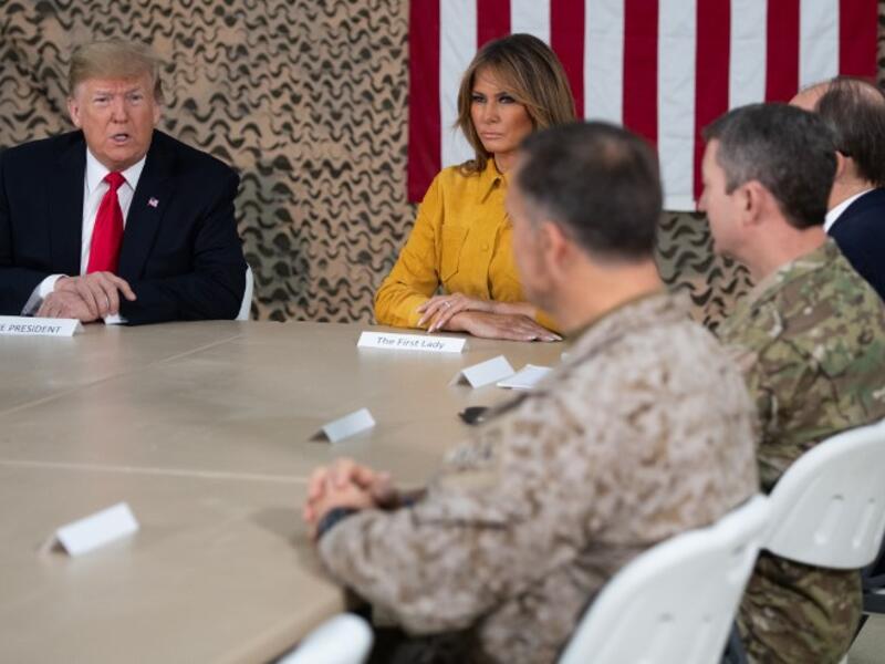 US President Donald Trump and First Lady Melania Trump attend a military briefing during an unannounced trip to Al Asad Air Base in Iraq on December 26, 2018.
SAUL LOEB / AFP