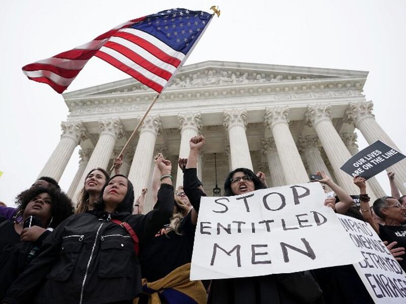 Activists occupy the front steps of the U.S. Supreme Court to protest against the confirmation Judge Brett Kavanaugh to the Supreme Court October 6, 2018 in Washington, DC.  (Alex Wong/Getty Images/AFP)