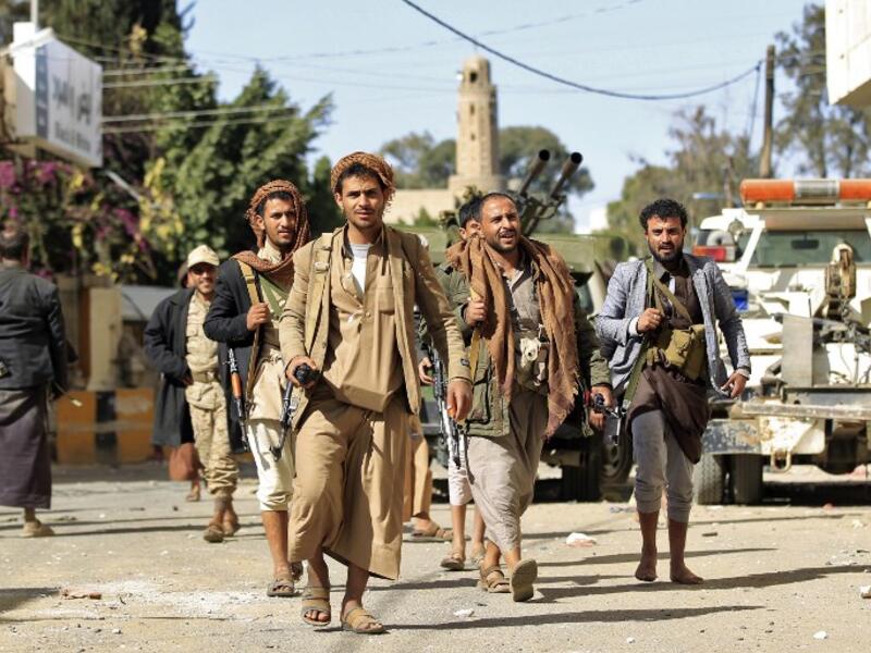 Houthi rebel fighters are seen outside of the residence of Yemen's former President Ali Abdullah Saleh in Sanaa on December 4, 2017. (Mohammed Huwais/AFP)