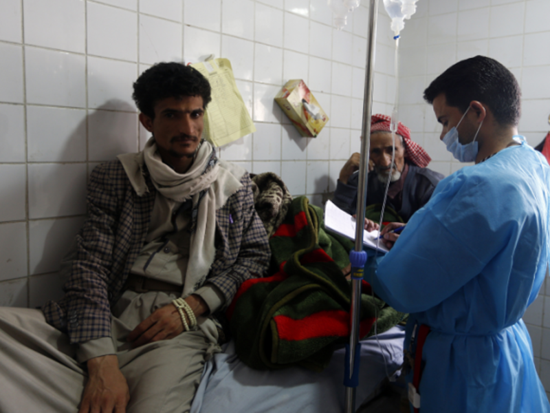 Yemeni men suspected of being infected with cholera receive treatment at a hospital in Sanaa on May 12, 2017.  (AFP)