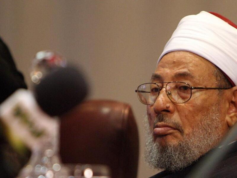 The global police agency issued arrest warrant for Yousef al-Qaradawi in 2014 at request of Egypt’s post-coup regime. (AFP/File)