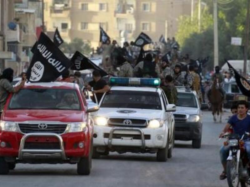 A parade of ISIS fighters in Raqqa (file photo)