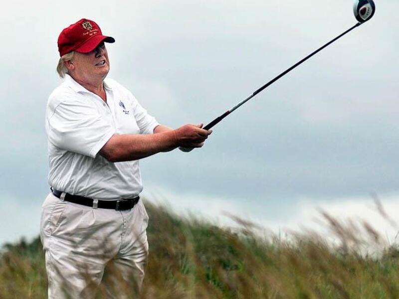 Donald Trump golfing. (AFP/ Andy Buchanan)