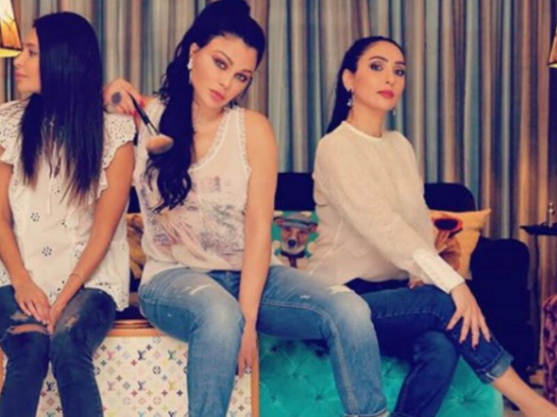 The Lebanese diva and her sisters sported casual looks with denim tight pants